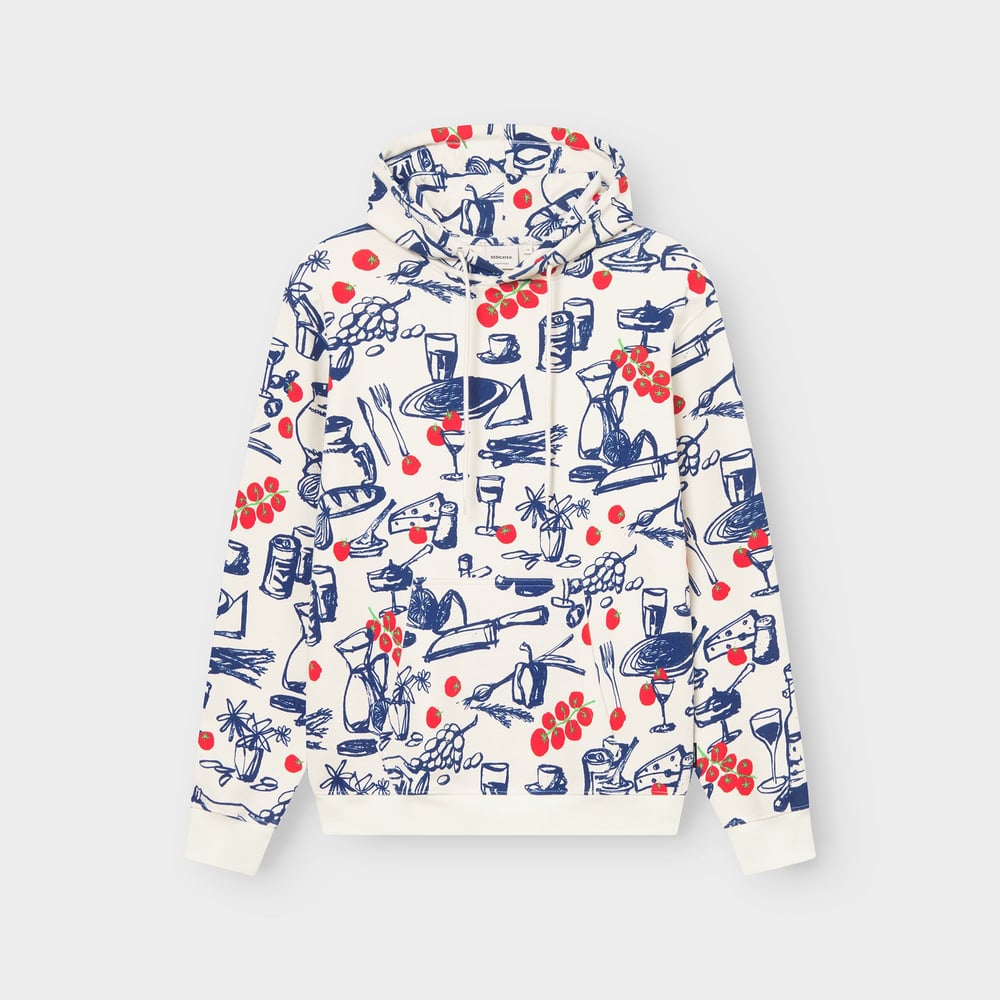 Studio shot of the Hoodie Falun in oat white, featuring a fun all-over 'Dinner Time' print in blue and red.