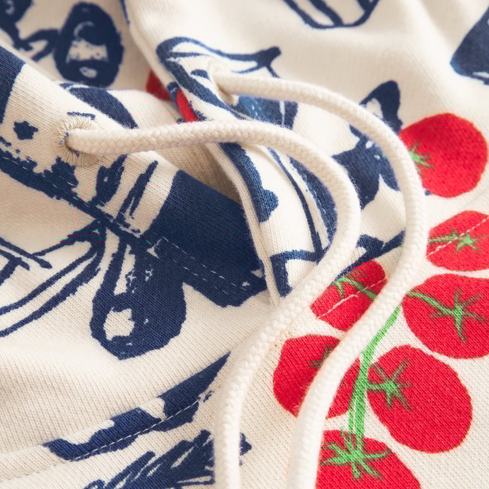 Close-up detail of the Hoodie Falun Dinner Time in oat white, showing the fun print and thick cotton drawstring.