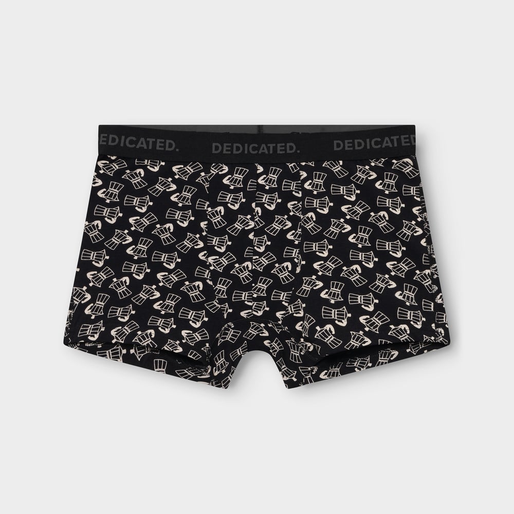 A flat lay photo of the black Kalix boxer briefs, featuring an all-over print of beige moka pots and a branded waistband.