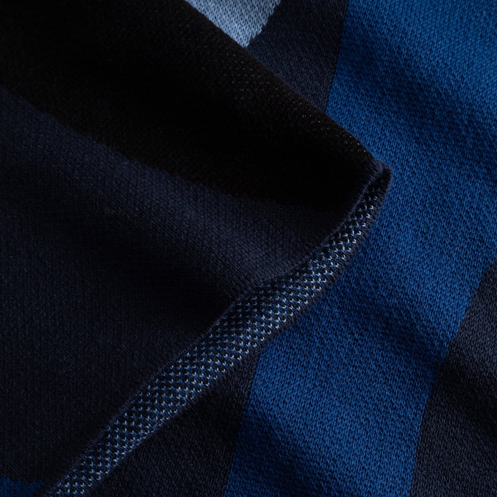 A close-up showing the soft texture and fine jacquard knit of the Dress Nikkala in its Wavy Stripe Blue pattern.