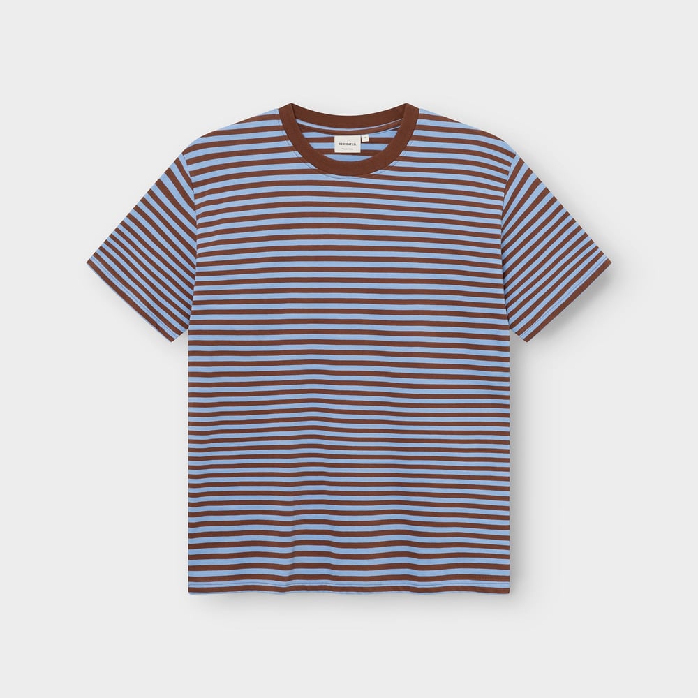 The T-shirt Stockholm Stripes in Cappuccino Brown and Cornflower Blue, photographed flat against a light grey background.