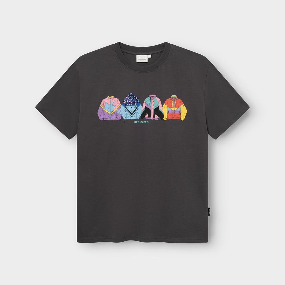 A flat lay of the T-shirt Stockholm Im Fashion in charcoal, featuring a colourful graphic of four retro-style jackets.
