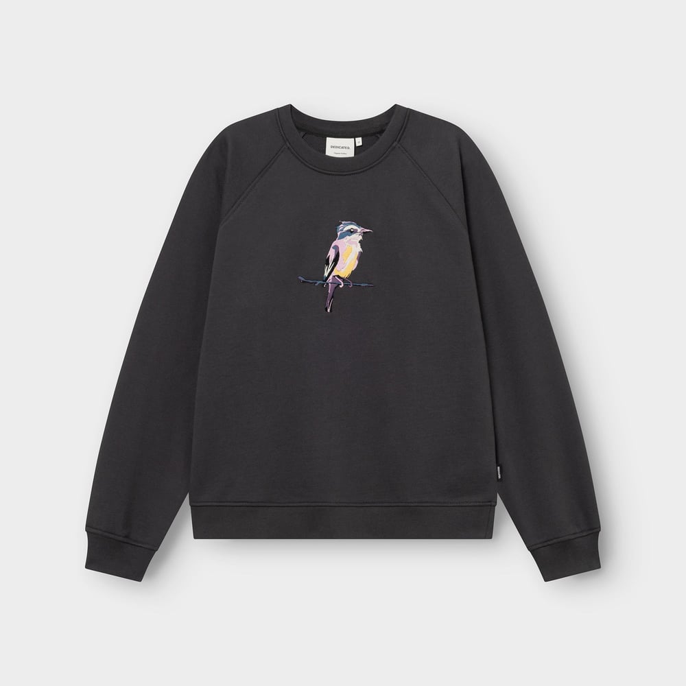 Flat lay of the charcoal Ystad sweatshirt, featuring a colorful and detailed embroidery of a painted bird on the chest.
