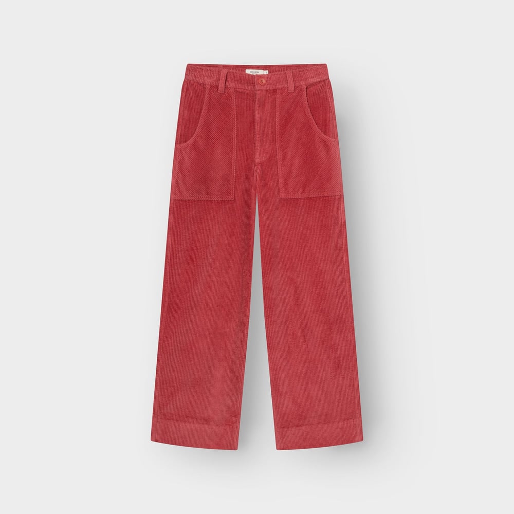 A flat-lay image of the Vara Workwear Pants in Holly Red corduroy, showcasing their wide-leg cut and large patch pockets.