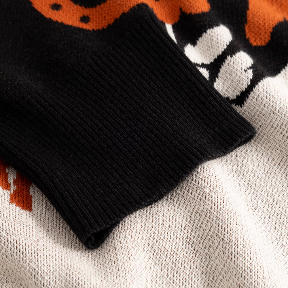 Detailed shot of the black ribbed cuff and multi-color jacquard knit on the Kanan Western Cardigan.