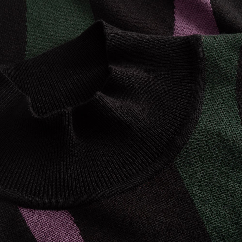 Close-up detail of the high ribbed collar on the jacquard knit Dress Nikkala, showing the multi-colored wavy stripe pattern.