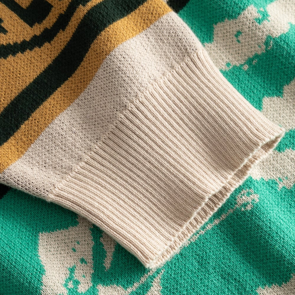 Close-up of the ribbed cuff on the multi-colored Sweater Mora Retro Ski Blocks, showing the detailed jacquard knit.