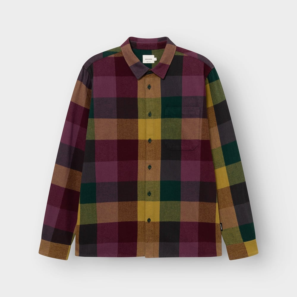 Product shot of the Rute Flannel Shirt in a bold multi-color check, laid flat against a studio background.
