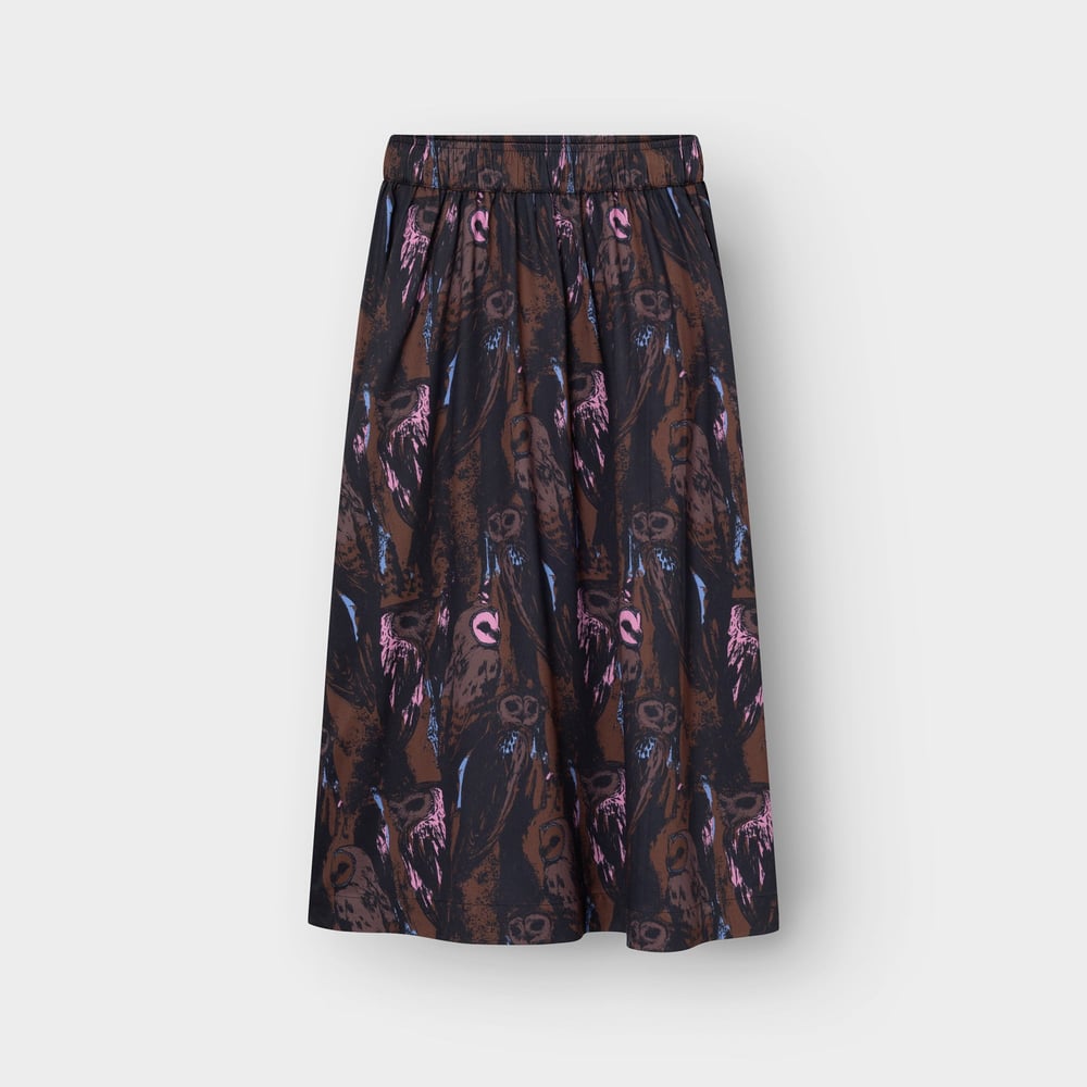 The Viken skirt, a flowing A-line style, covered in a fun and quirky all-over owl print in shades of brown and pink.