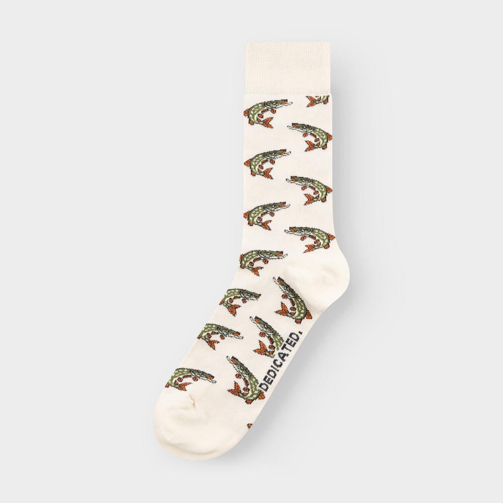 Studio shot of an off-white sock with a fun all-over pattern of illustrated green and orange pike fish.