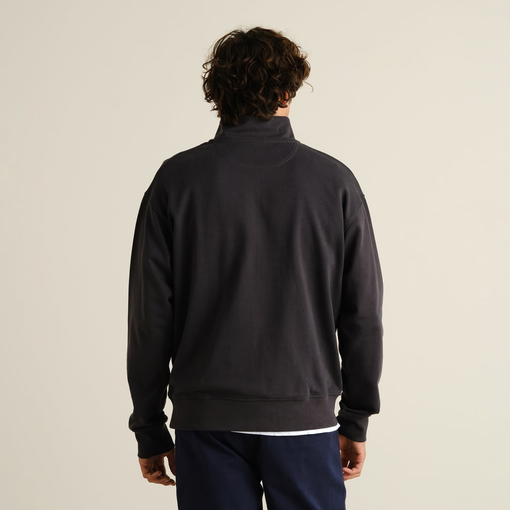 Back view of a man wearing the relaxed-fit Half Zip Sweatshirt Sandvalla in Phantom Black.
