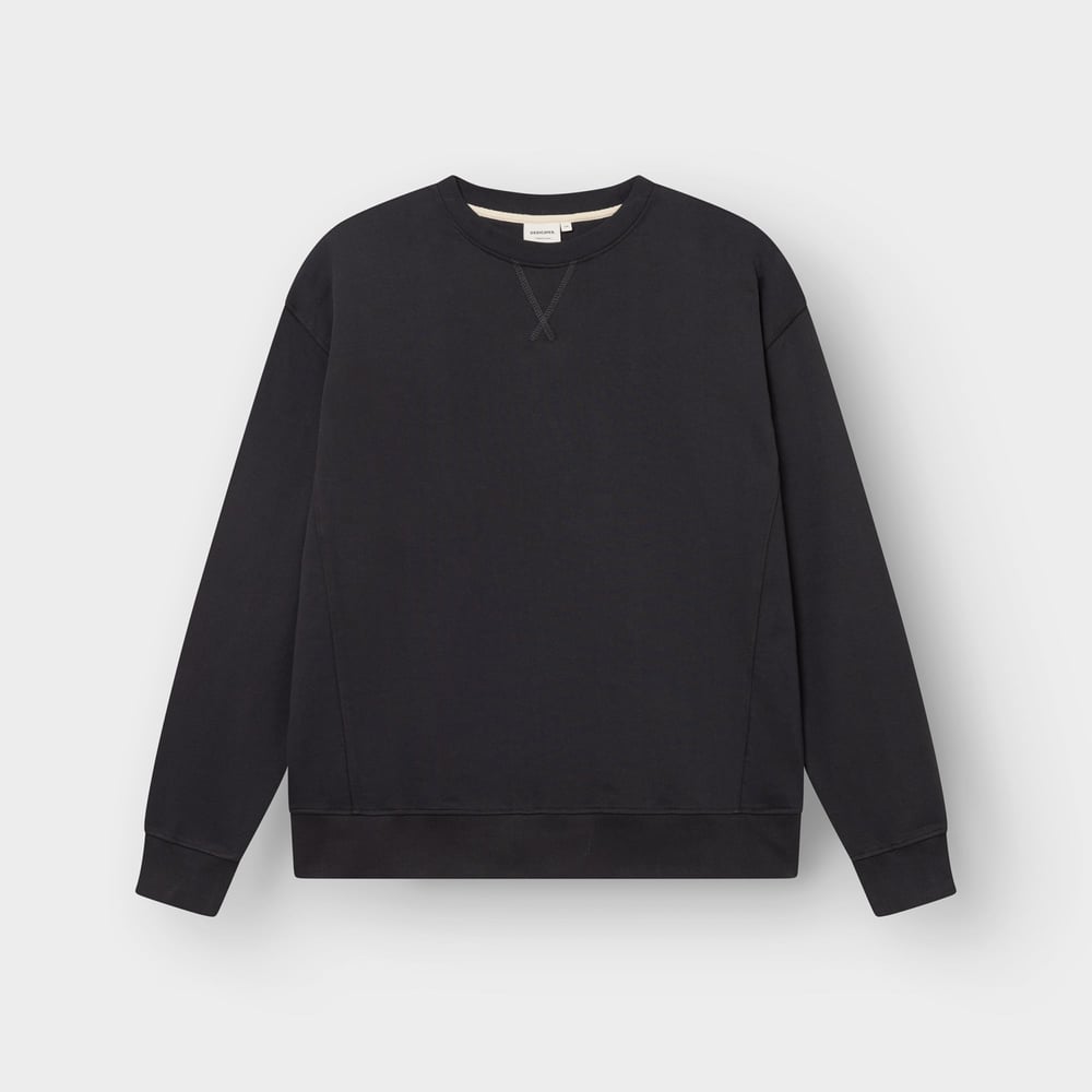 A flat lay image of the Dedicated Sweatshirt Bettna in Phantom Black, showcasing its clean lines and relaxed silhouette.