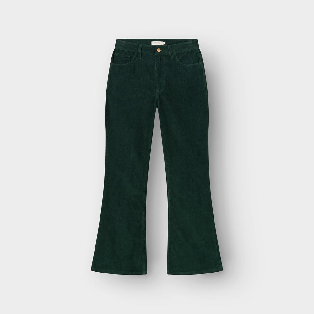 The Ryda pants in dark green corduroy, shown from the front to highlight the flattering bootcut fit.