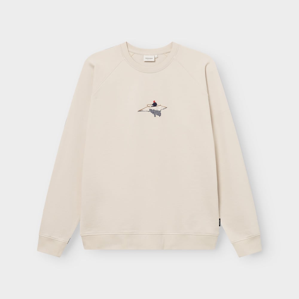 Studio shot of the classic Sweatshirt Malmoe in Oat White, featuring a charming embroidered rowing boat on the chest.