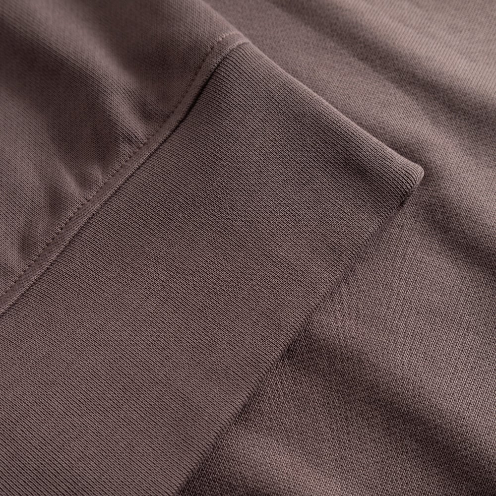 A close-up shot showing the ribbed cuff detail on the Half Zip Sweatshirt Sandvalla in Sparrow Brown.