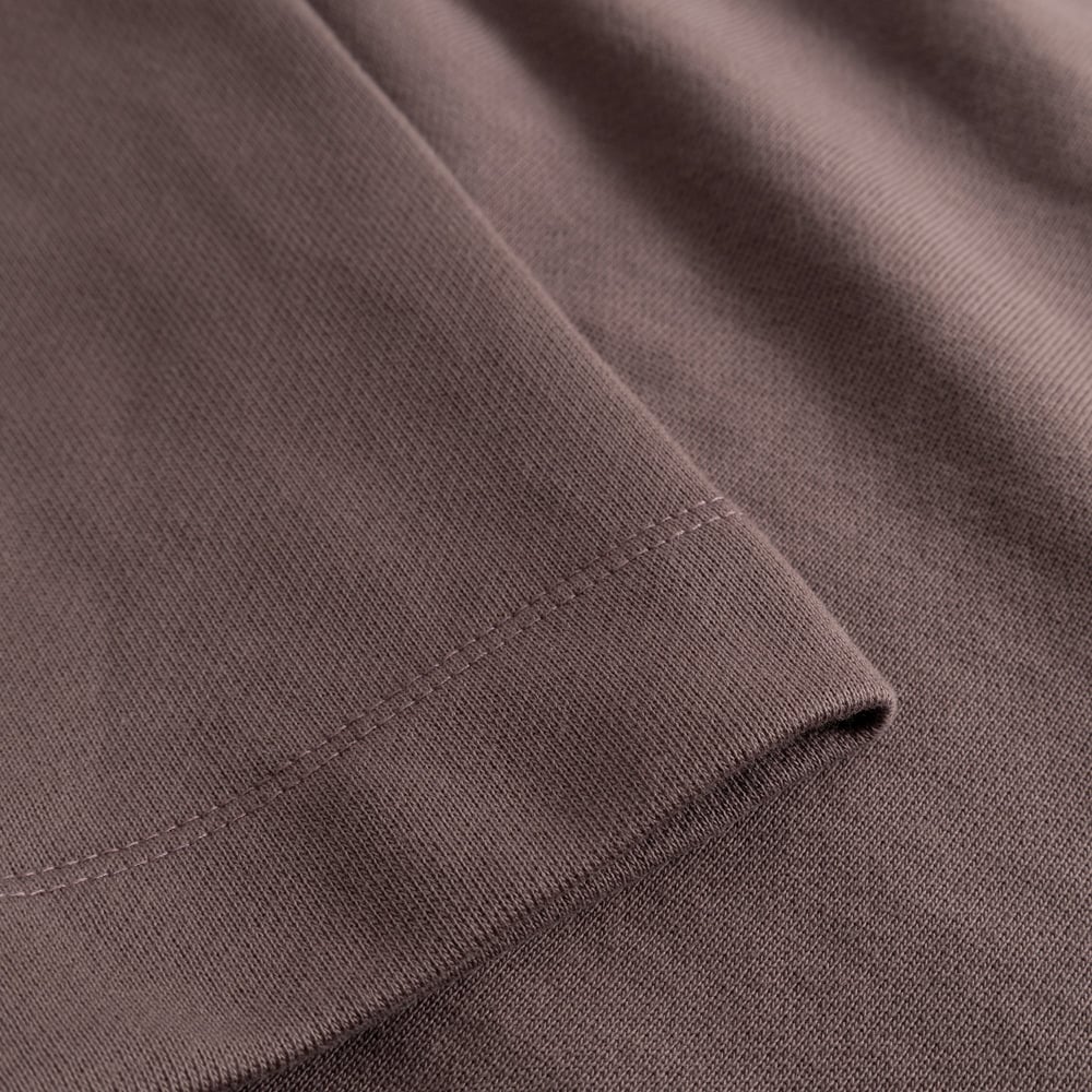 A close-up shot of the rich Sparrow Brown fabric and neat cuff detail on the Gia sweatshirt.