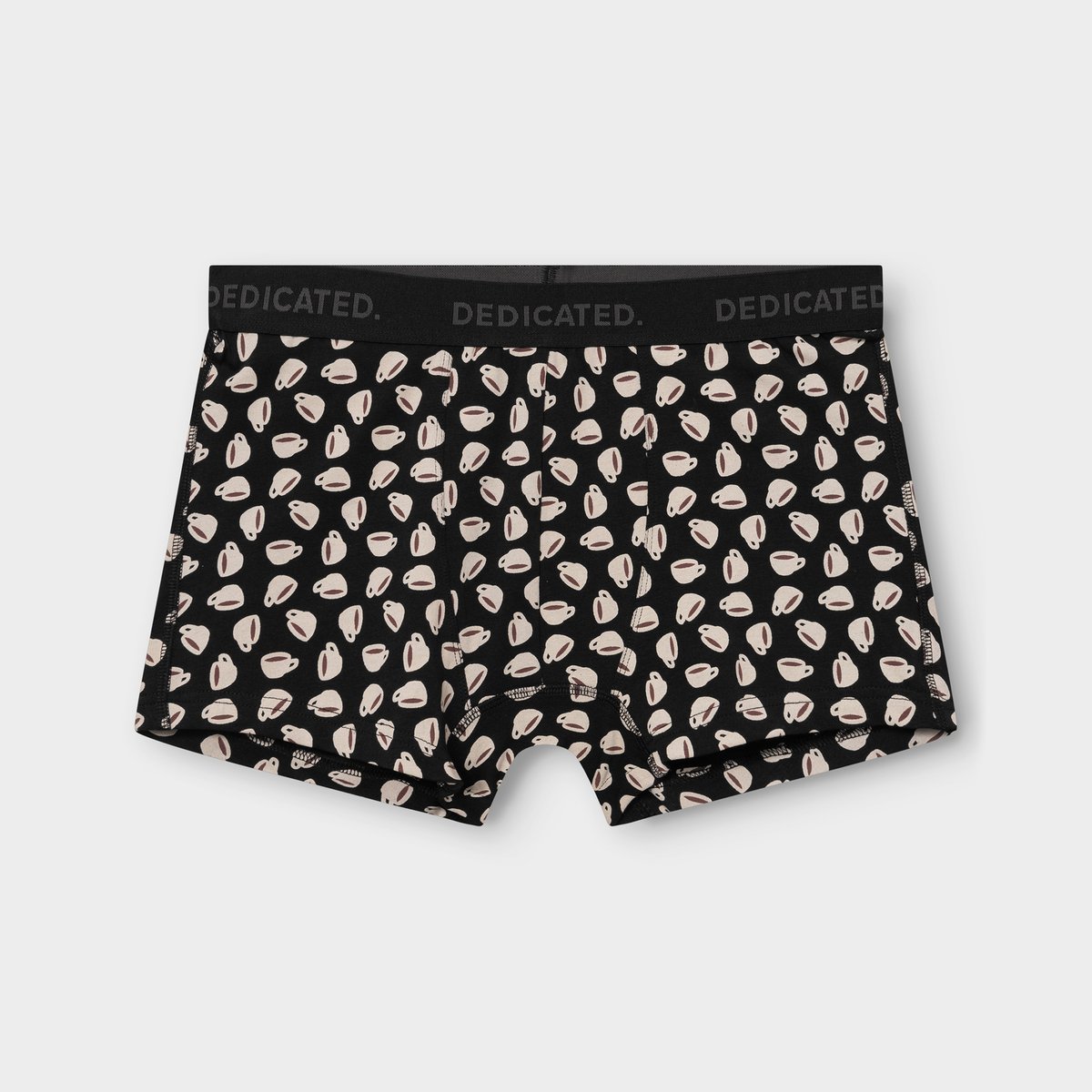 A pair of black boxer briefs with a fun all-over coffee cup print, photographed flat on a grey background.