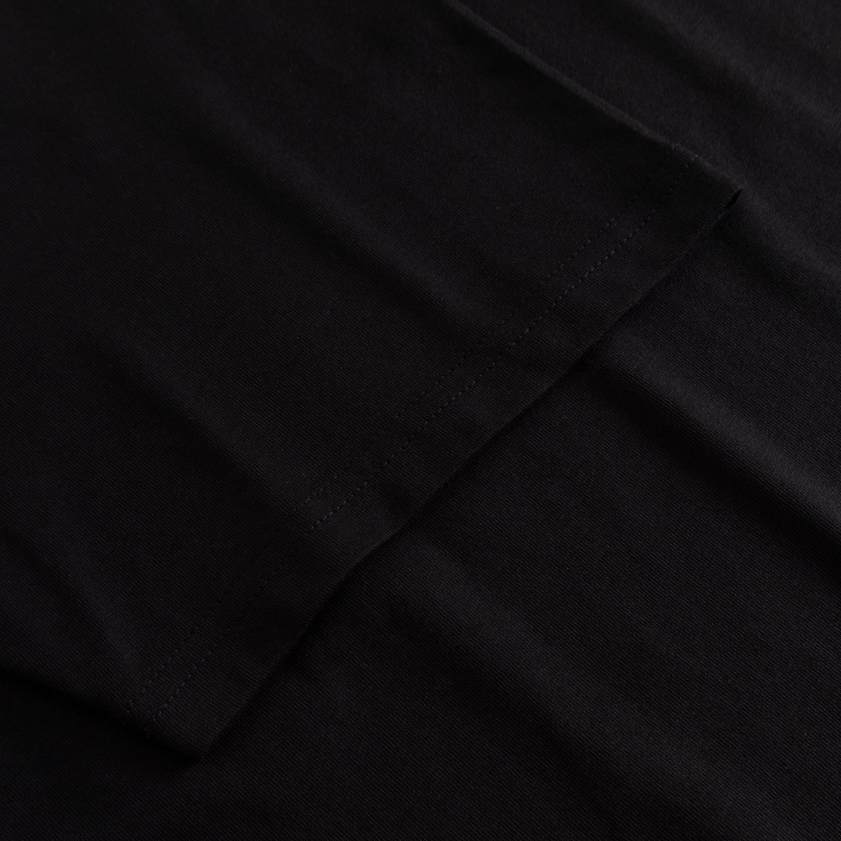 A close-up showing the soft organic cotton and neat stitching on the sleeve of the Stockholm t-shirt.