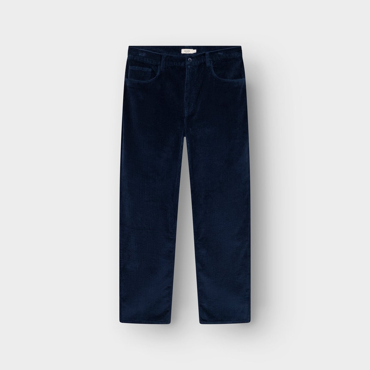 Front view of the Hamburg Corduroy Pants in navy blue, laid flat against a light background.