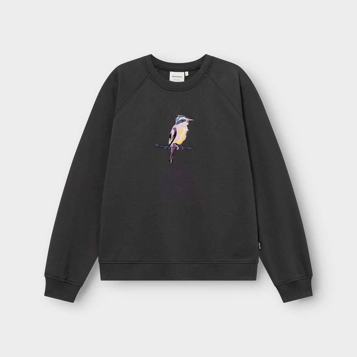 Flat lay of the charcoal Ystad sweatshirt, featuring a colorful and detailed embroidery of a painted bird on the chest.