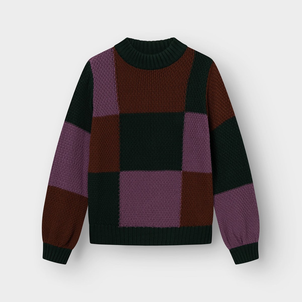 Front view of the Sweater Gotland, a chunky knit with a multi-color blocked check pattern in purple, brown, and dark green.