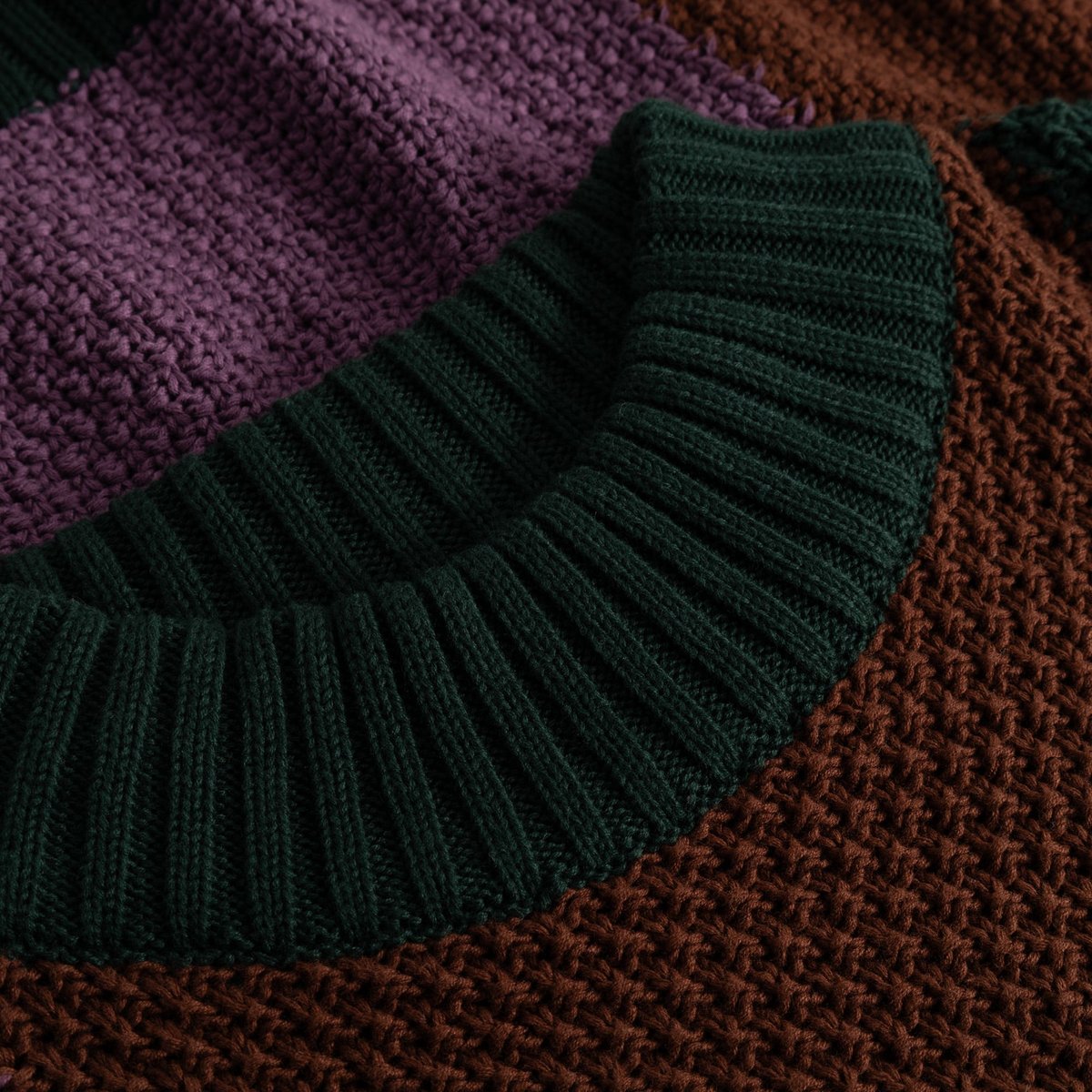Close-up of the Sweater Gotland Blocked Check showing the chunky, multi-colored knit and cozy ribbed high neck.