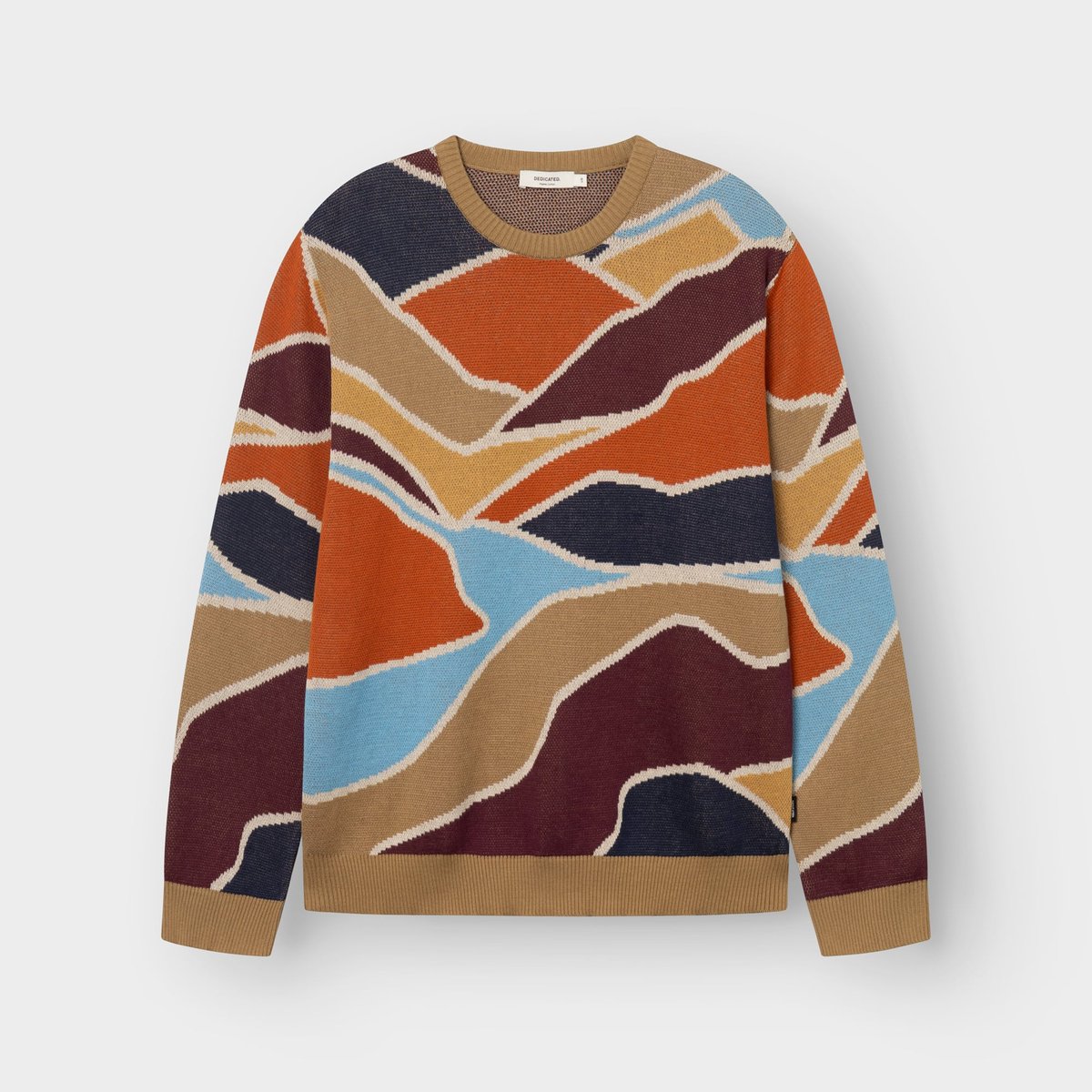 The Sweater Mora Patch Valley laid flat, featuring a colorful jacquard knit pattern inspired by rolling landscapes.
