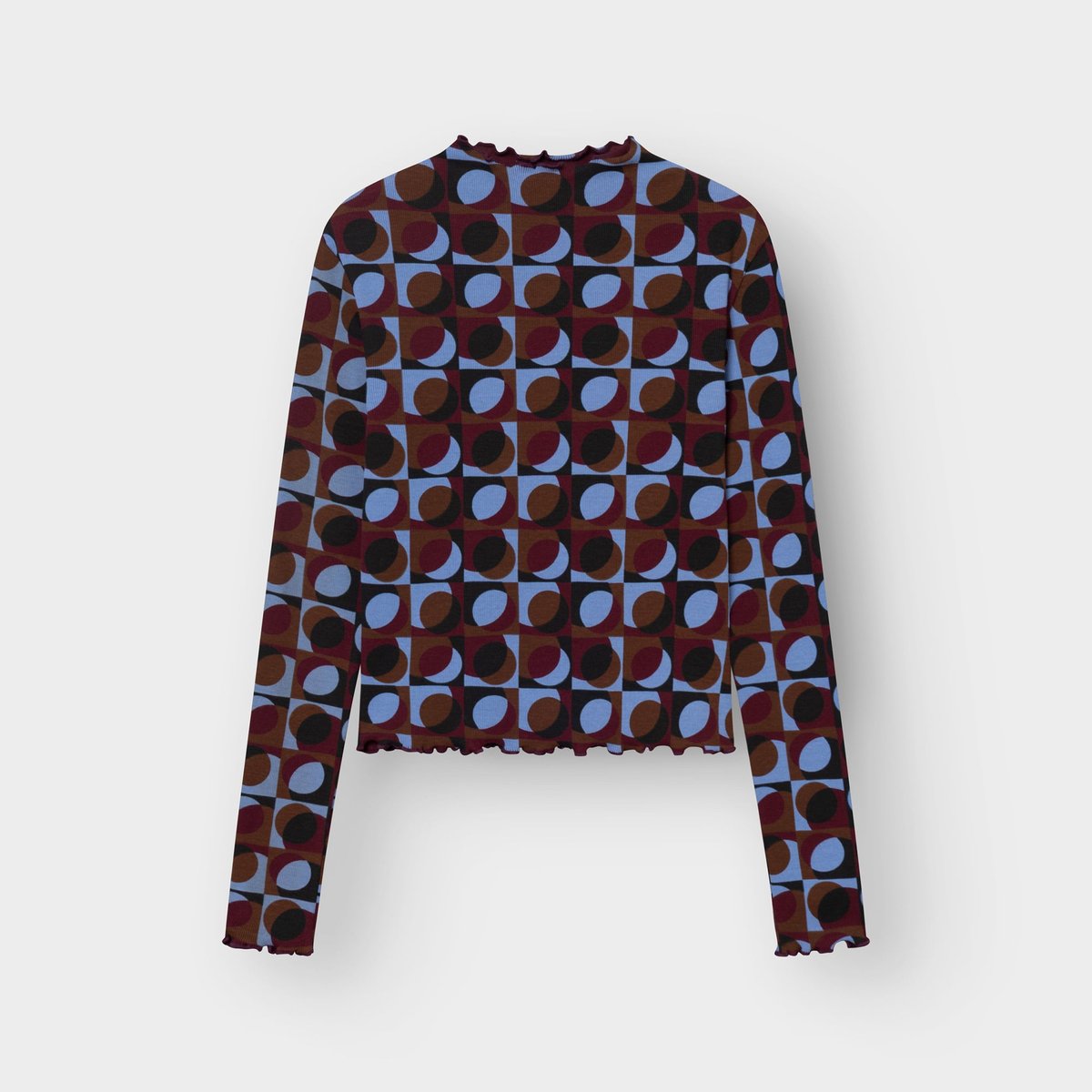 Flat lay of the long-sleeved Rib Top Ryd, showing its colorful Retro Geo all-over print and wavy lettuce-edge details.