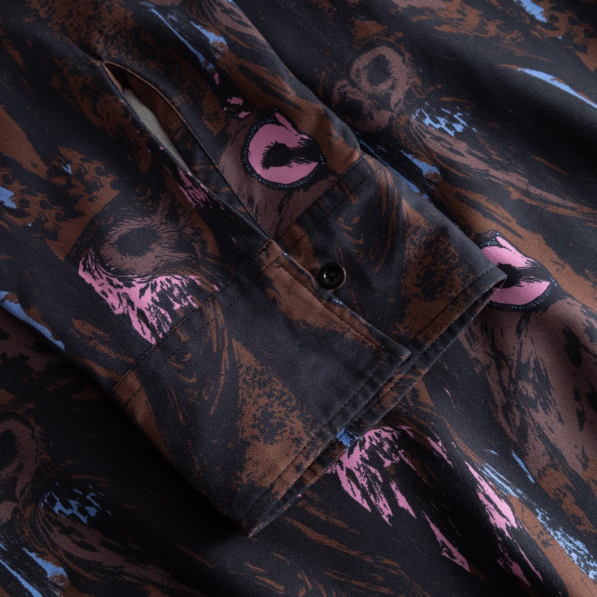 Close-up of the Kvilla Shirt Dress sleeve, showing the buttoned cuff and the detailed multi-color Owls print.