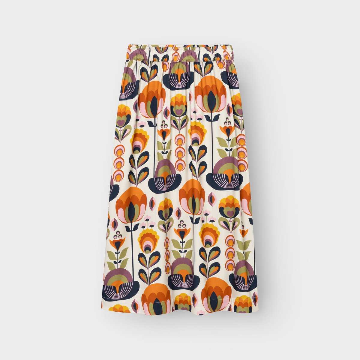 Studio shot of the Skirt Viken in Autumn Harvest Multi Color. The A-line skirt features a playful, retro floral pattern.