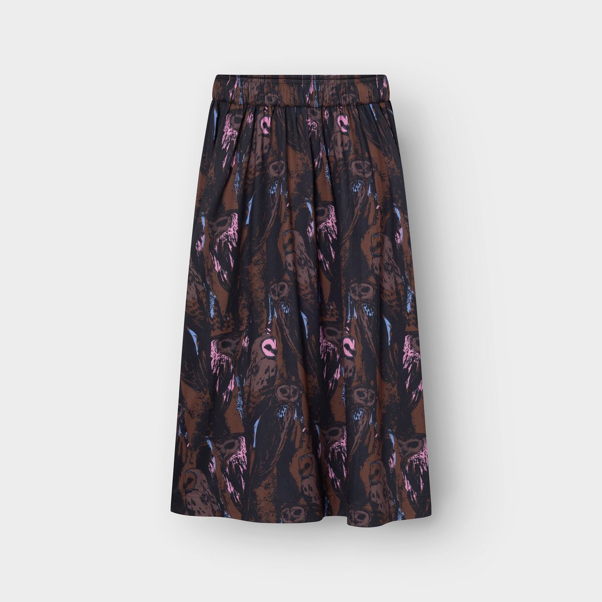 The Viken skirt, a flowing A-line style, covered in a fun and quirky all-over owl print in shades of brown and pink.