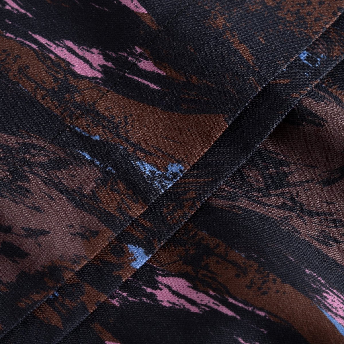 A detailed close-up of the Skirt Viken Owls, showing the soft fabric and its artistic multi-colored brushstroke print.