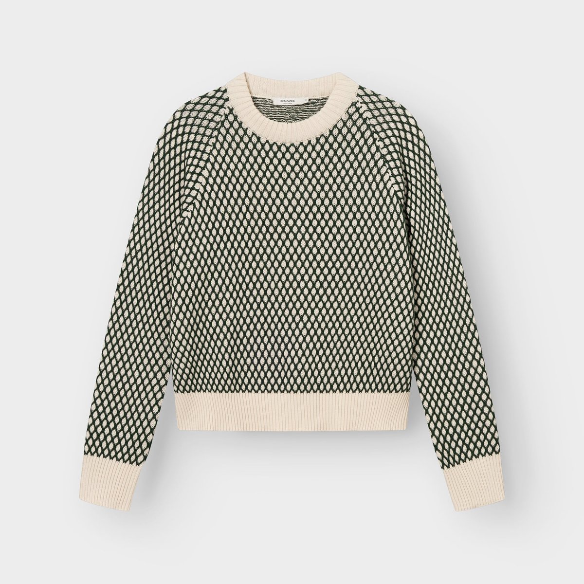 Tröjan Husie Bubble Knit i mörkgrönt och vaniljvitt, fotograferad platt mot en ljusgrå bakgrund.