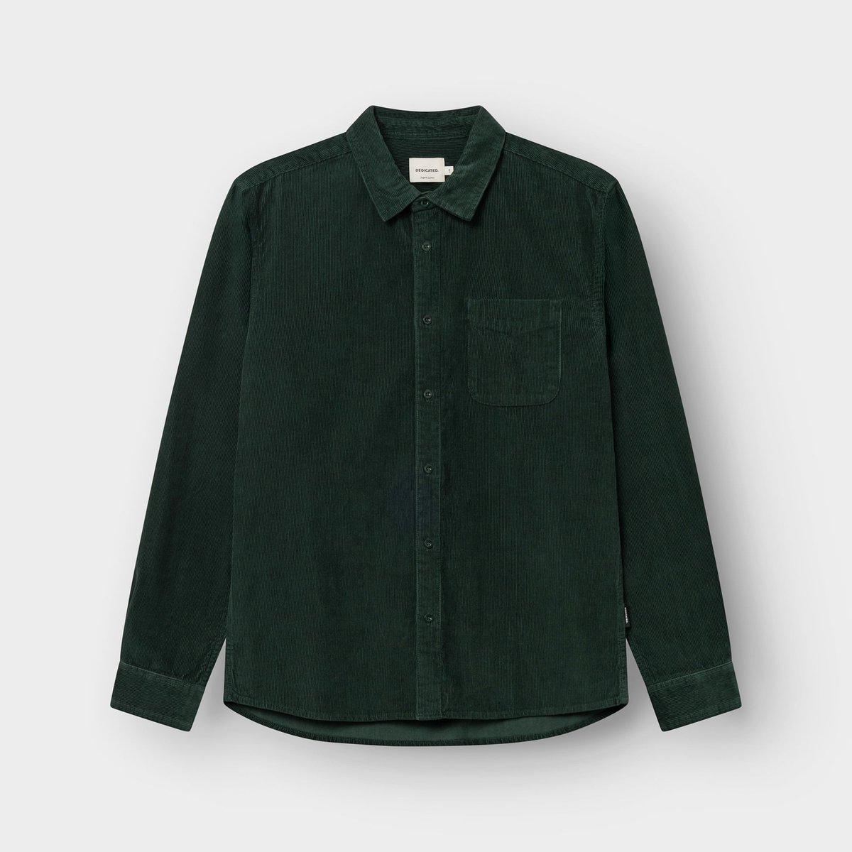 Studio photo of the Shirt Varberg Corduroy in Dark Green, laid flat.