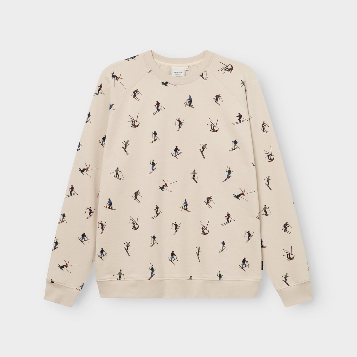 Studio shot of the oat white Sweatshirt Malmoe Ski Team, featuring a fun all-over print of tiny, colorful skiers.