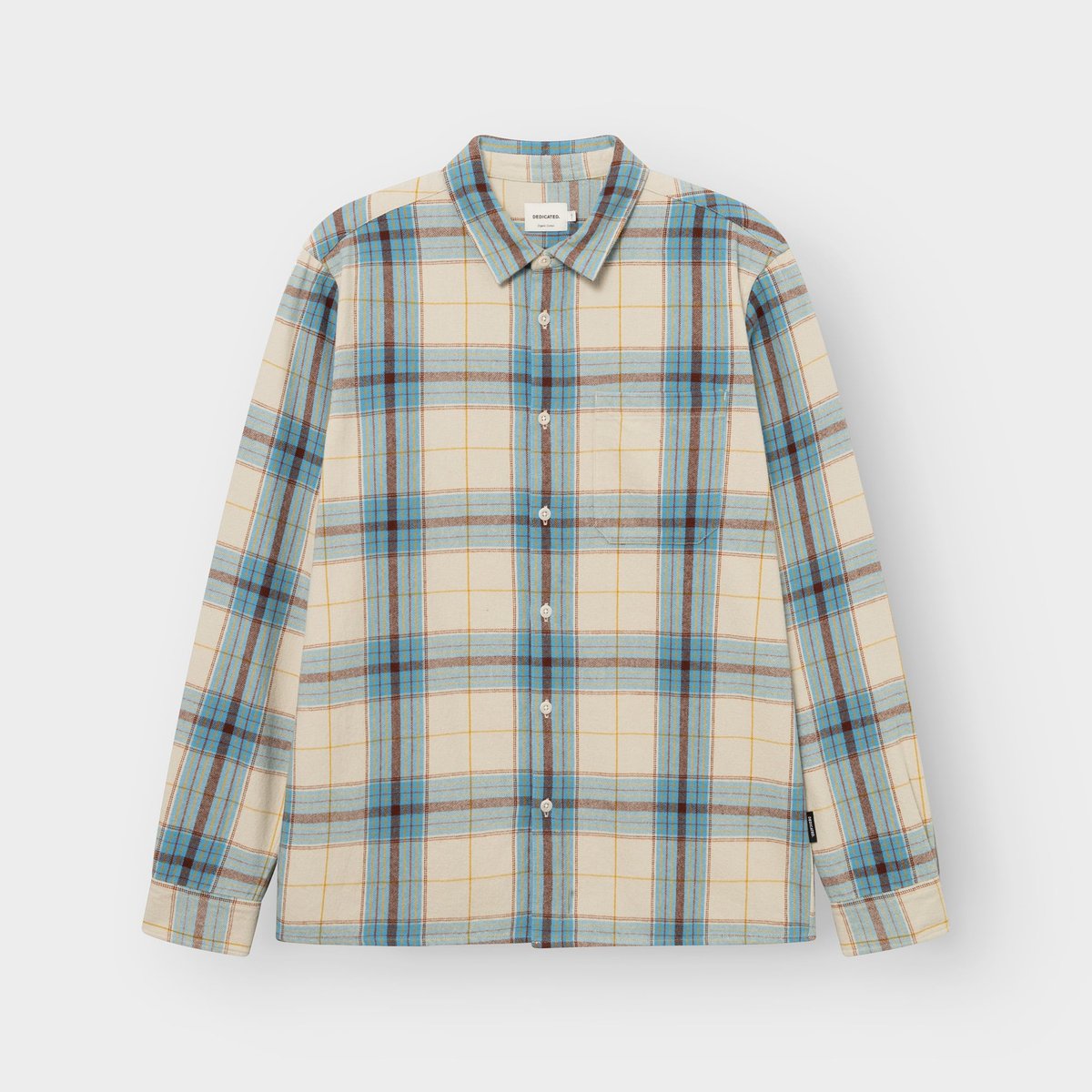 Photo de studio de la chemise Rute en flanelle à carreaux tartan blanc avoine, bleu et brun, à plat sur fond gris clair.