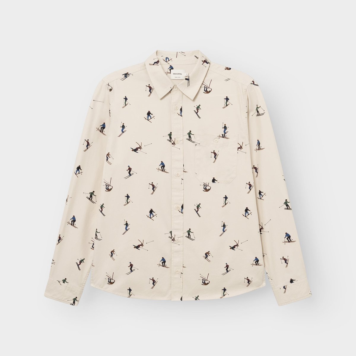 Flat lay of the oat white Shirt Lunnevik Ski Team, a long-sleeved button-up shirt with a fun all-over skier print.