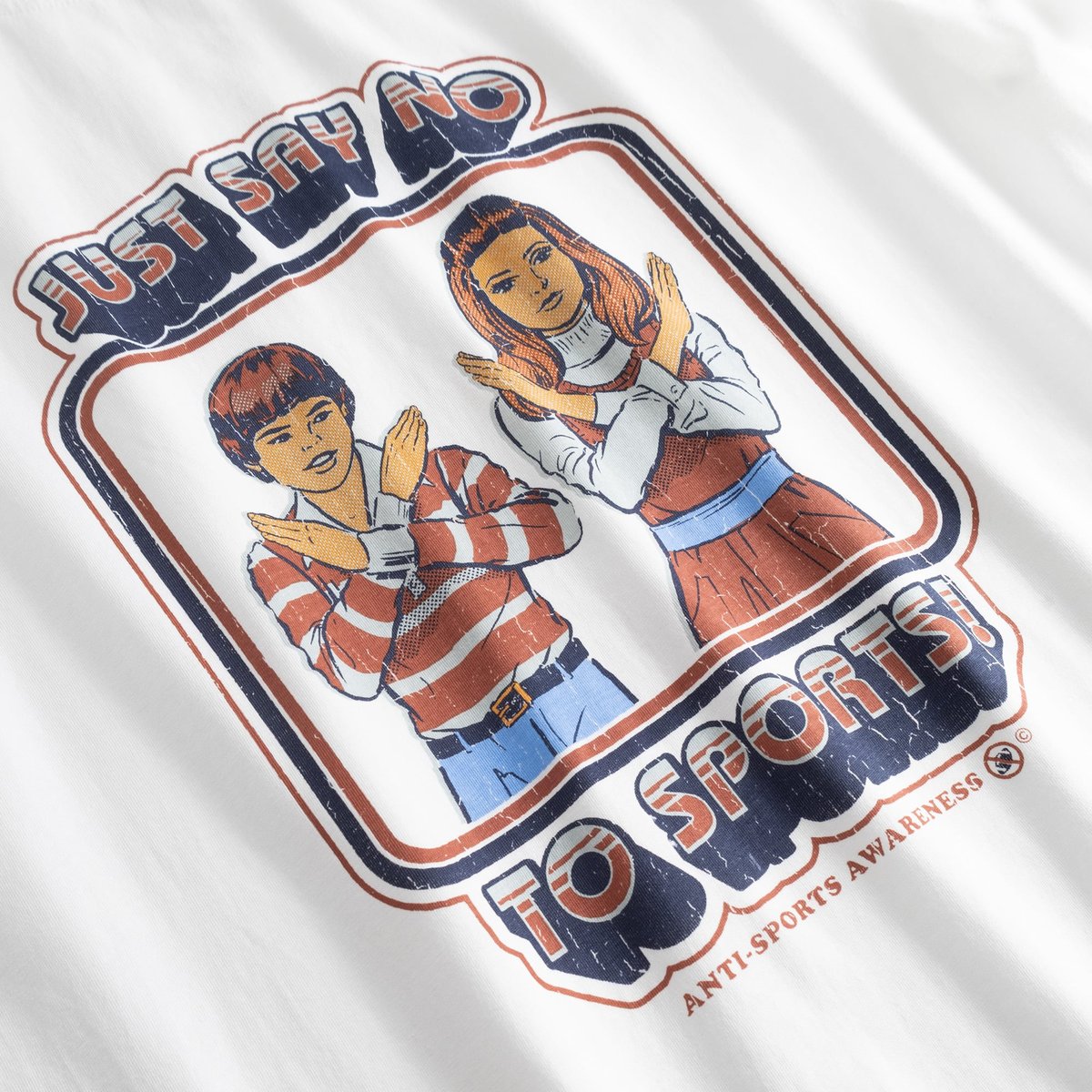 Close-up of the retro-style 'Say No To Sports' print by Steven Rhodes on the white Stockholm T-shirt.