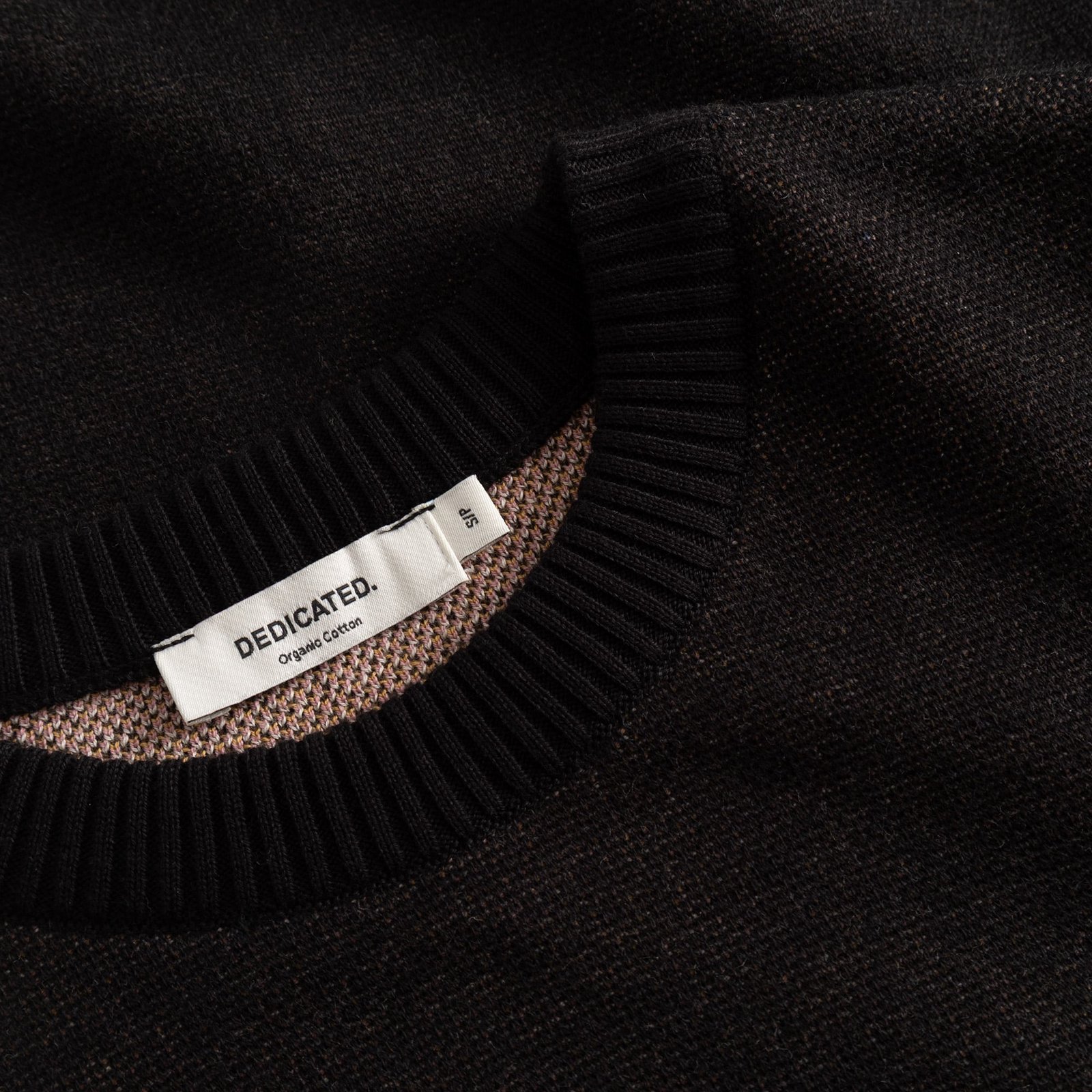 Get up close with the Sweater Arendal Long Cat. See the fine jacquard knit and soft ribbed neckline in classic black.