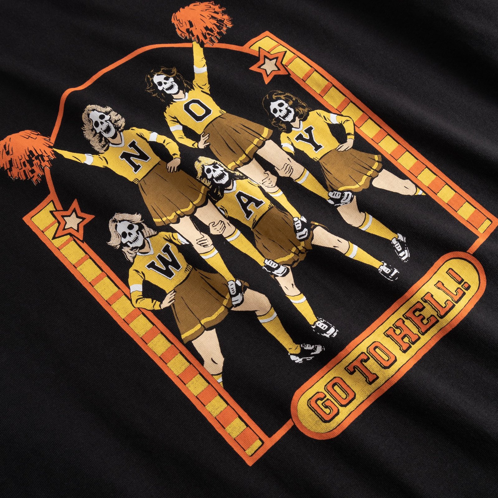 Close-up of the 'Go To Hell' print by Steven Rhodes, showing skeleton cheerleaders on the black t-shirt.
