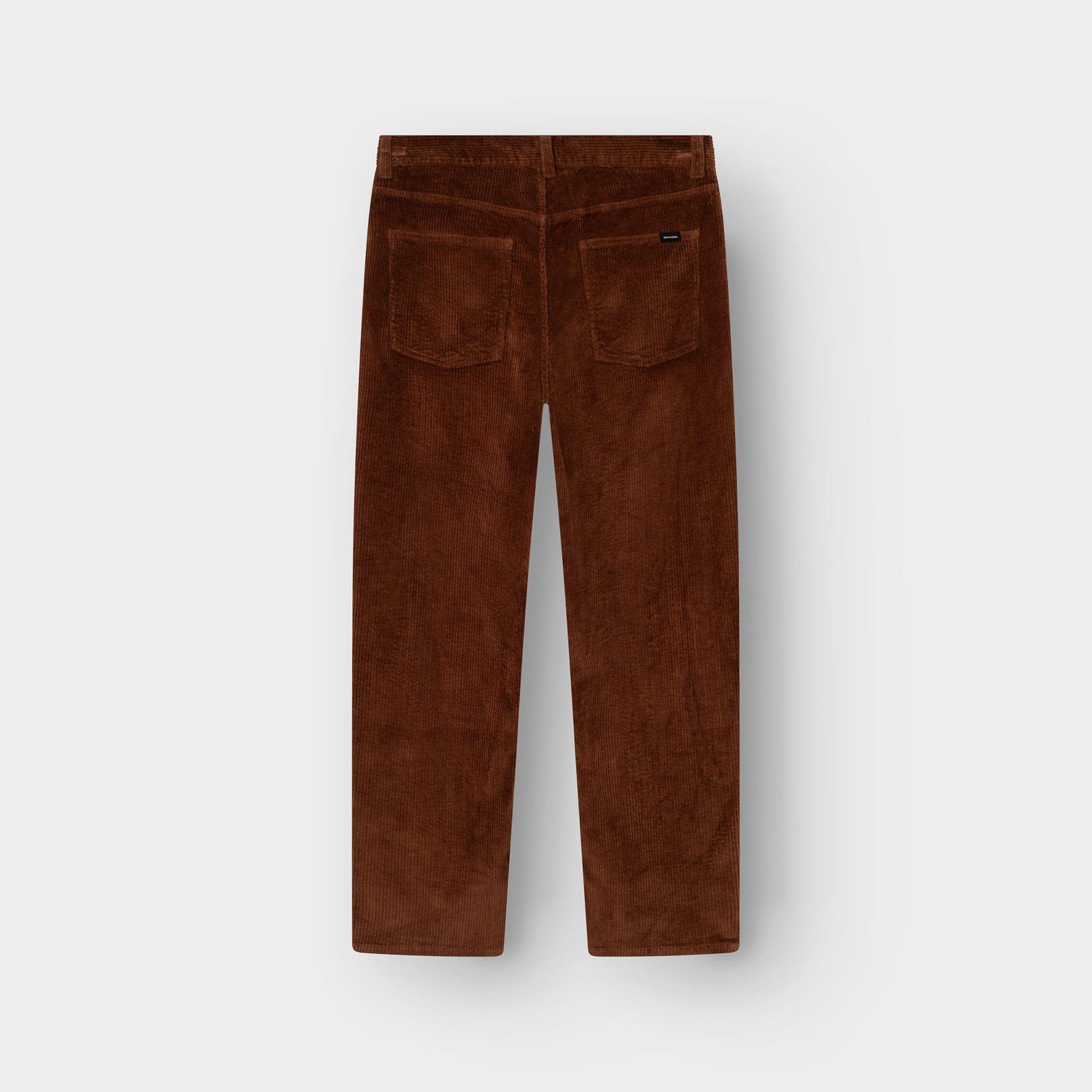 A back view of the Pants Hamburg Corduroy in Cappuccino Brown, highlighting its relaxed fit and retro texture.