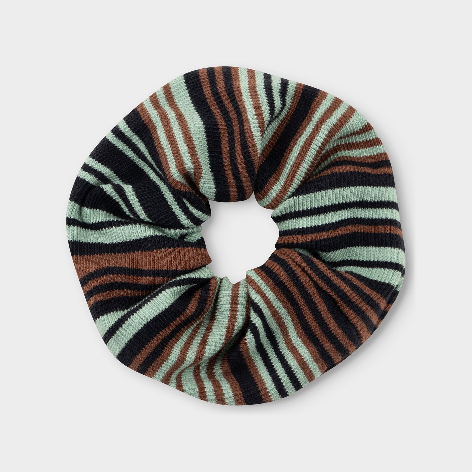 A ribbed scrunchie with an irregular stripe pattern in green, brown, and black, pictured against a light grey background.