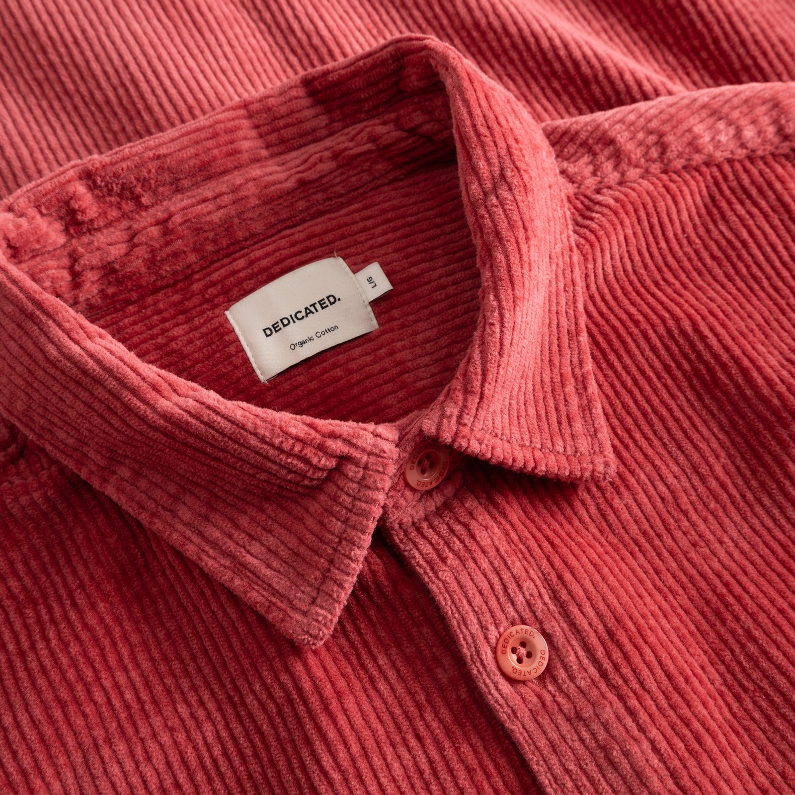 A close-up of the Shirt Kil Corduroy in Holly Red, showcasing the rich texture of the fabric and the classic collar design.