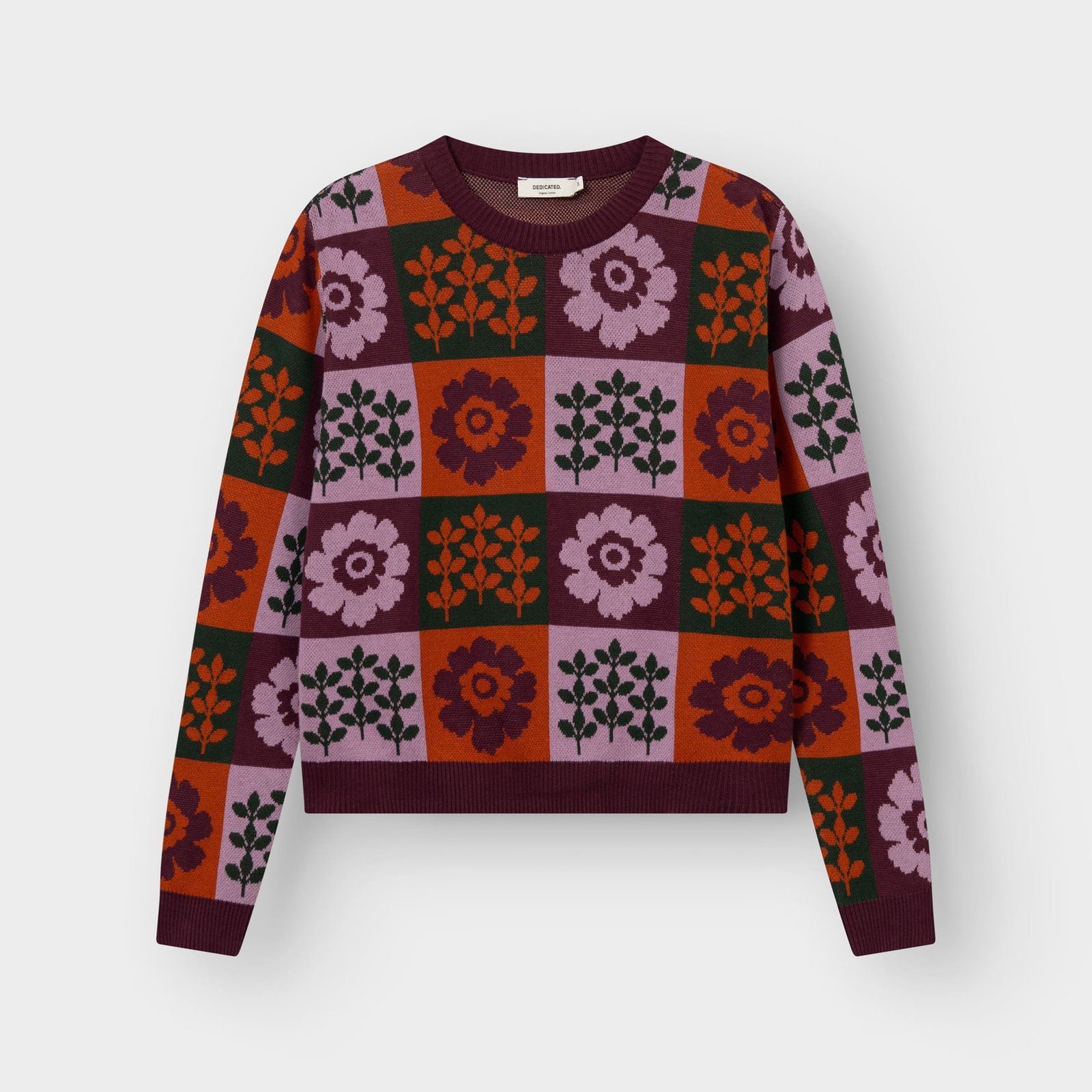 Front view of the Sweater Arendal Nature Check, a jacquard knit with a colorful checkerboard pattern of flowers and leaves.