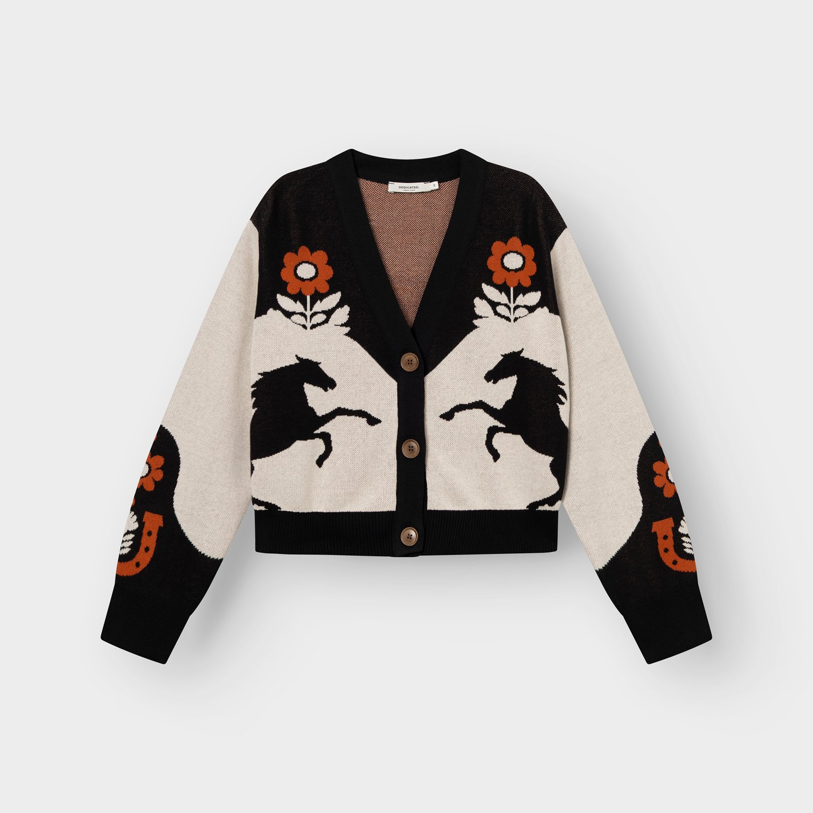 A fun, western-inspired jacquard knit cardigan. The Cardigan Kanan features a playful pattern of horses and flowers.
