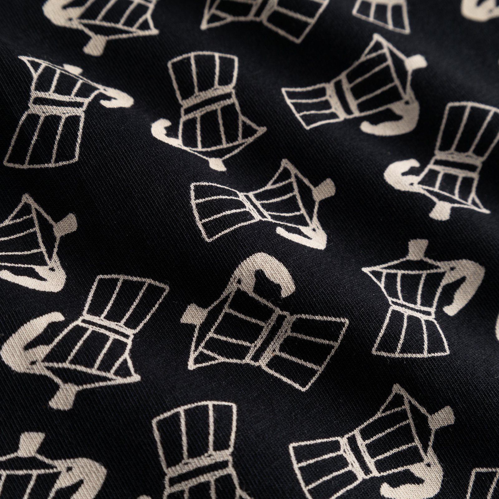 Close-up of the playful moka pot print on the soft, black fabric of the Kalix Good Morning boxer briefs.