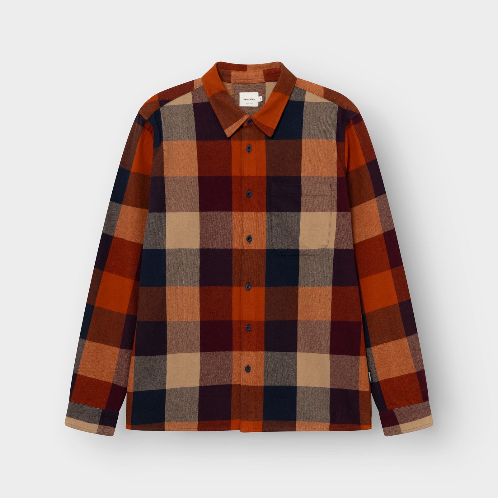 The Rute Flannel Shirt laid flat, showing off its cozy check pattern in muted shades of orange, navy, and beige.