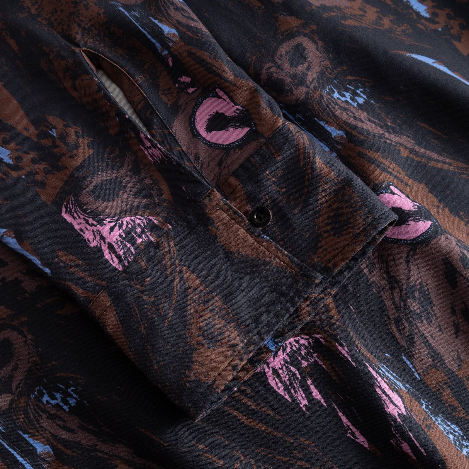 Close-up of the Kvilla Shirt Dress sleeve, showing the buttoned cuff and the detailed multi-color Owls print.