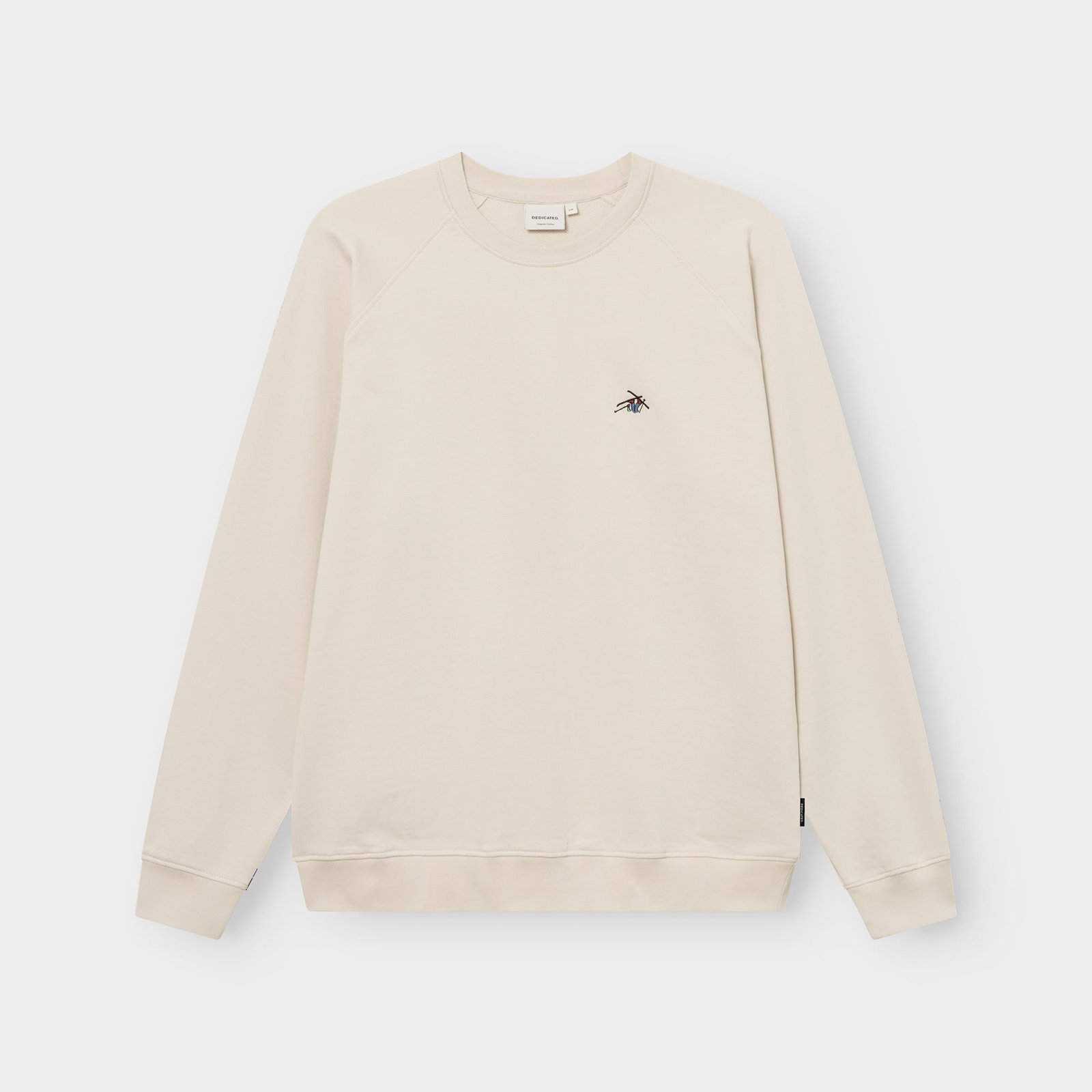 Front view of the oat white Sweatshirt Malmoe, laid flat, featuring a small, colourful 'Ski Crash' embroidery on the chest.