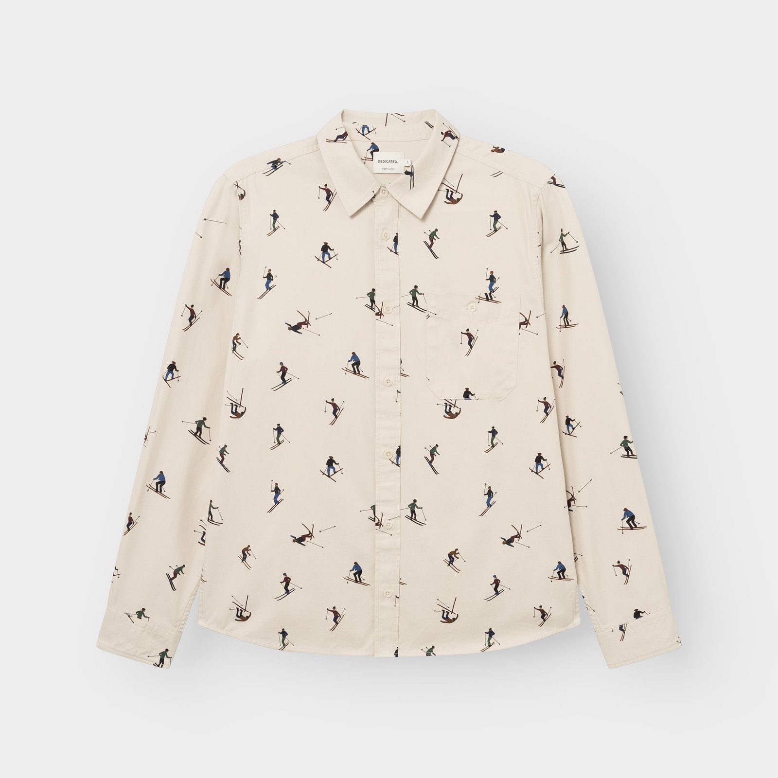 Flat lay of the oat white Shirt Lunnevik Ski Team, a long-sleeved button-up shirt with a fun all-over skier print.